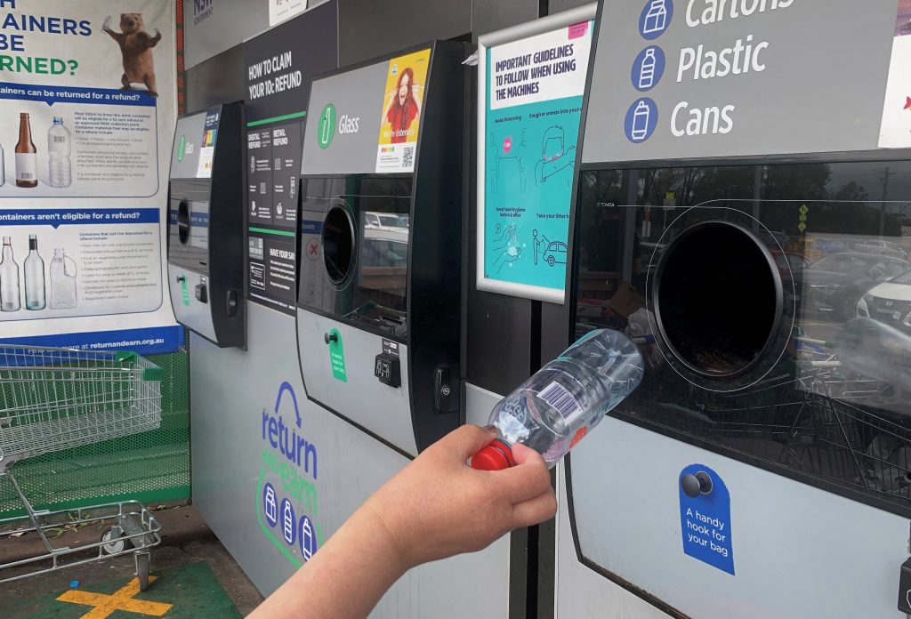 A customer participating in the container deposit scheme in NSW. Return and Earn.
