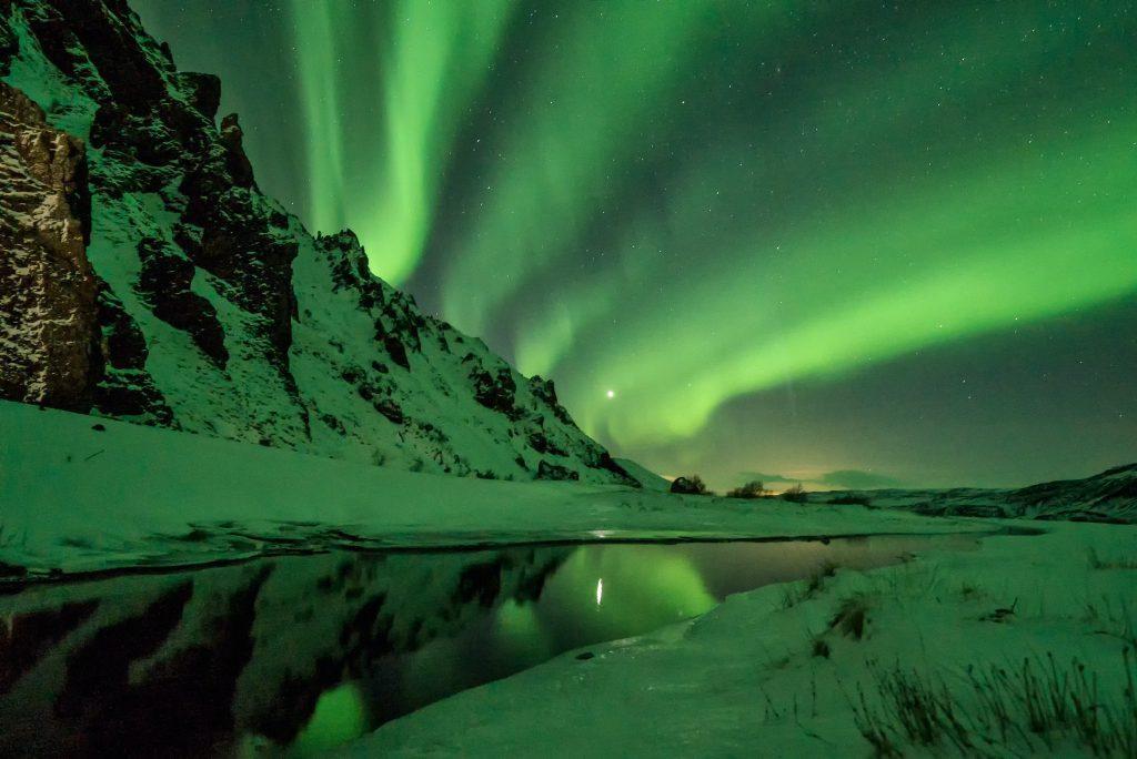 View of Northern Lights from a sustainable city