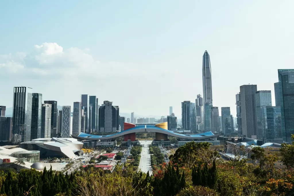 Panoramic view of Shenzhen’s modern cityscape featuring high-rise buildings and the landmark Civic Center, symbolizing China's urban development and its evolving approach to sustainable infrastructure.